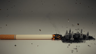 Burning cigarette destroying miniature graveyard with flying ash and embers