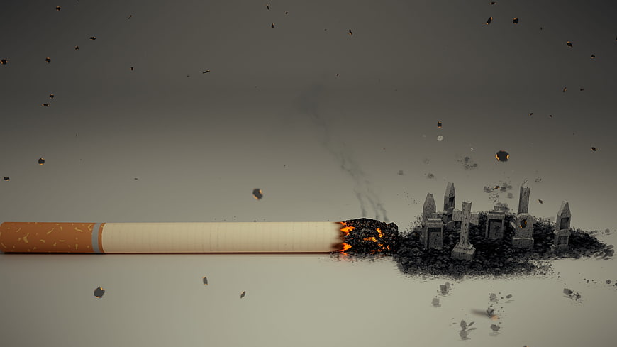 Burning cigarette destroying miniature graveyard with flying ash and embers