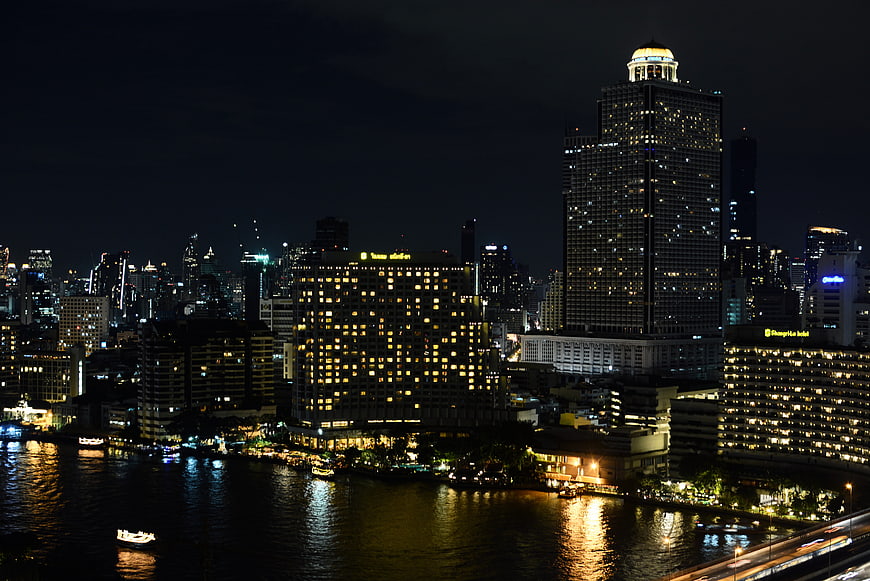 Bangkok Night Skyline with River Reflections and City Lights