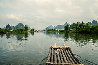 Bamboo raft on Li River with karst mountains in Guilin, China