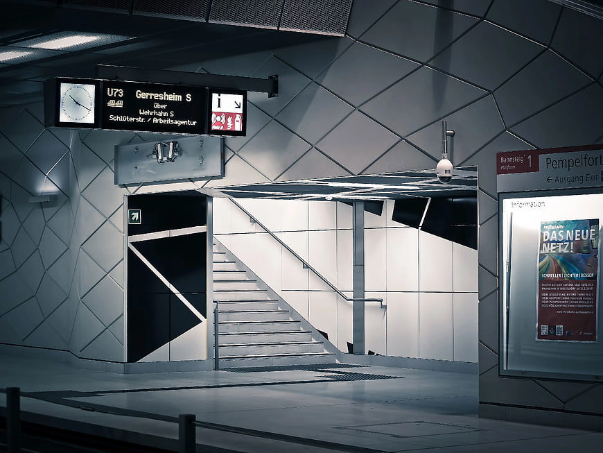 Modern subway station platform with geometric tiled walls