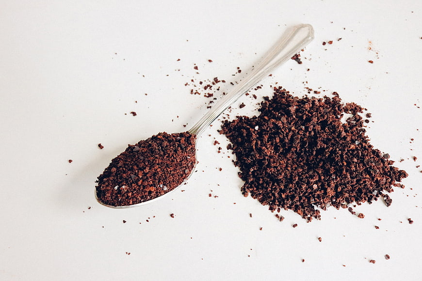 Instant Coffee Granules on Spoon and White Background