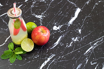 Fresh Apple Lime Detox Drink on Black Marble