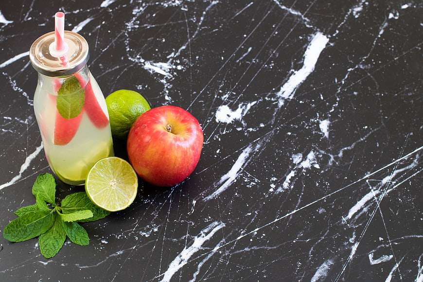 Fresh Apple Lime Detox Drink on Black Marble