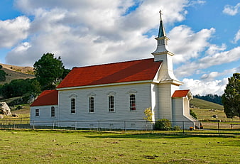 White Church with Red Roof in Rural Landscape