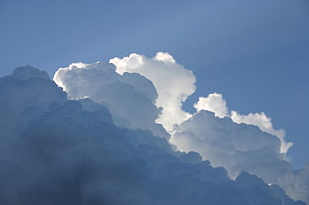 Dramatic Cumulonimbus Clouds Against Blue Sky