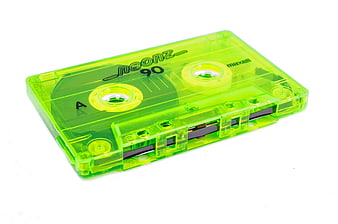 Neon green transparent Maxell 90 audio cassette tape isolated on white background