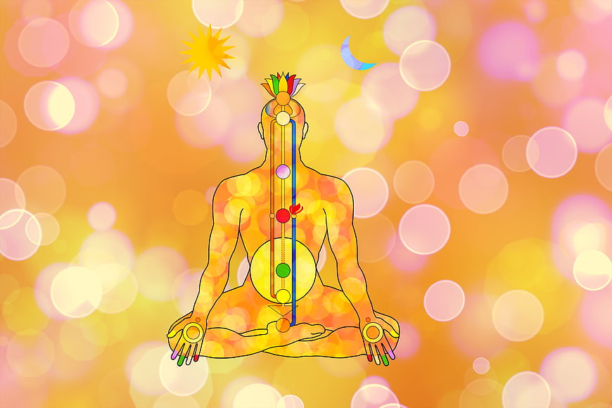 Meditating Figure With Chakra Energy Centers And Bokeh Background