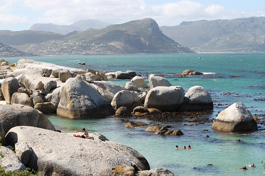 Scenic coastal landscape with large boulders and turquoise water