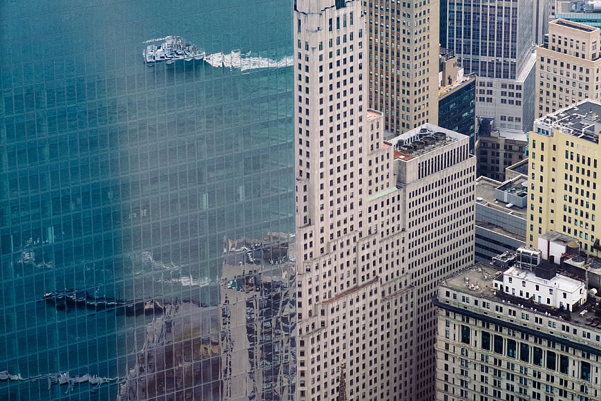High-angle view of city skyscrapers with glass reflection
