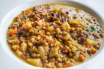 Hearty Lentil Soup with Vegetables in White Bowl
