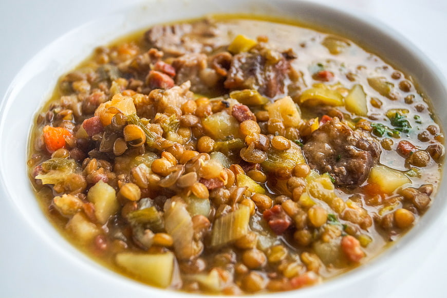 Hearty Lentil Soup with Vegetables in White Bowl