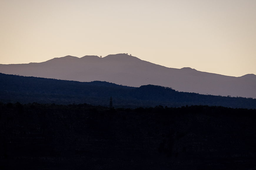Silhouetted Mountain Range at Dusk with Observatory