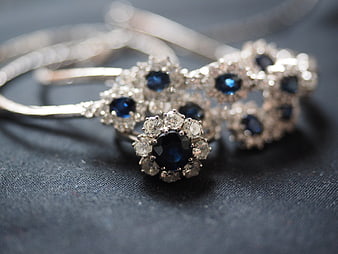Sapphire and Diamond Jewelry Set on Dark Textured Background