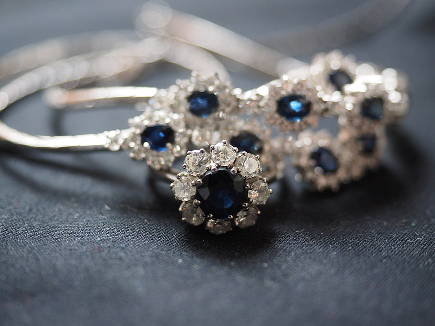 Sapphire and Diamond Jewelry Set on Dark Textured Background