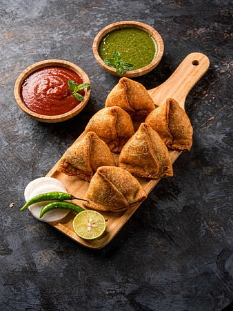 Crispy Samosas with Chutney on Wooden Board
