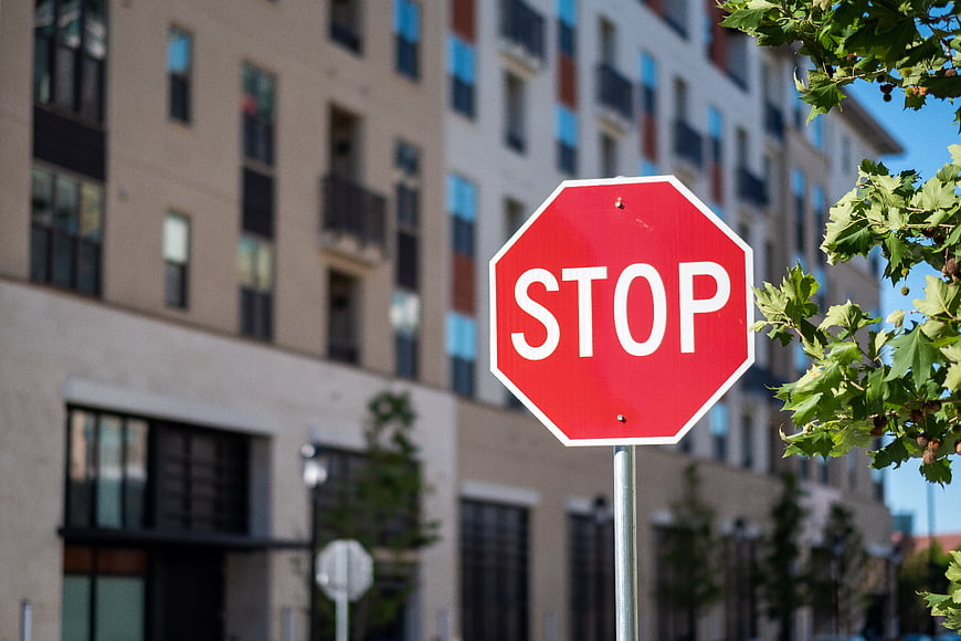 Red Stop Sign in Urban City Setting