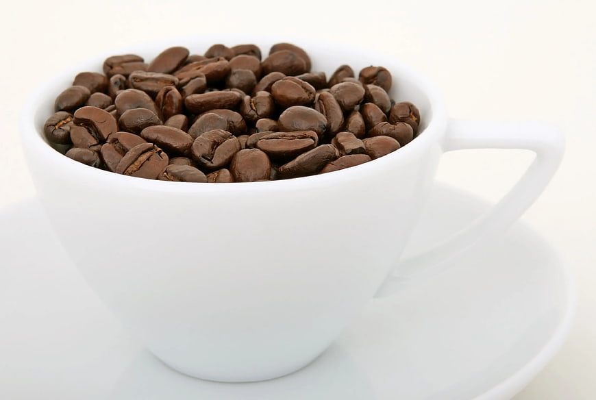Roasted Coffee Beans in White Ceramic Cup