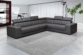 Modern gray leather sectional sofa in minimalist living room