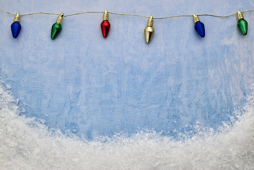 Vintage Christmas Lights on Blue Textured Background with Snow