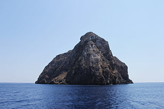 Solitary Rocky Island in Blue Ocean