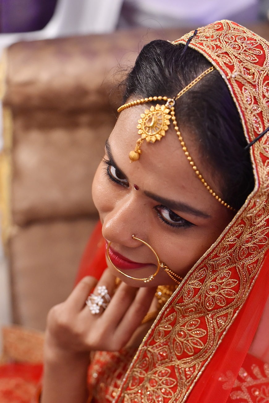 Indian Bride in Red Lehenga with Gold Jewelry