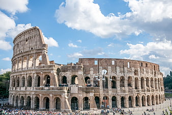 Colosseum in Rome, Italy, Under a Bright Blue Sky