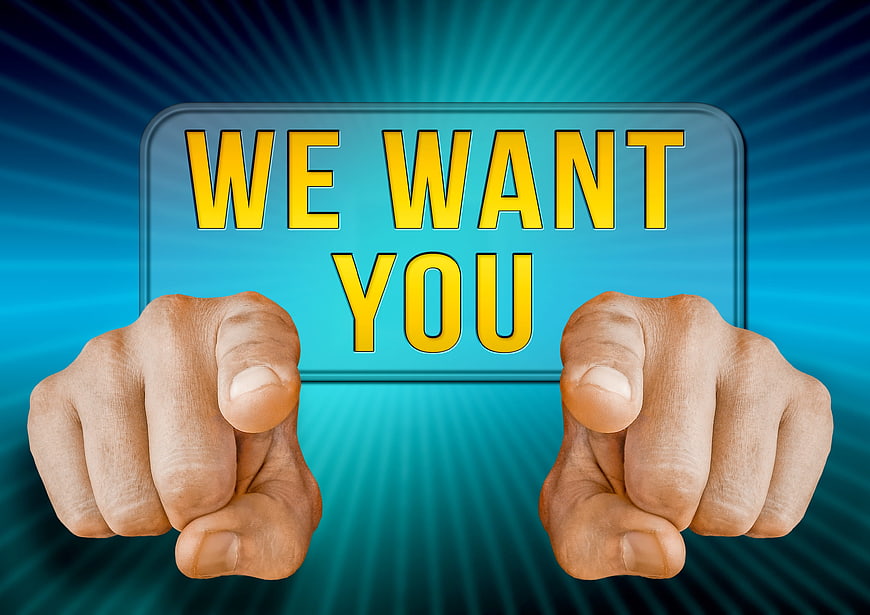 We Want You Sign With Pointing Fingers On Blue Background