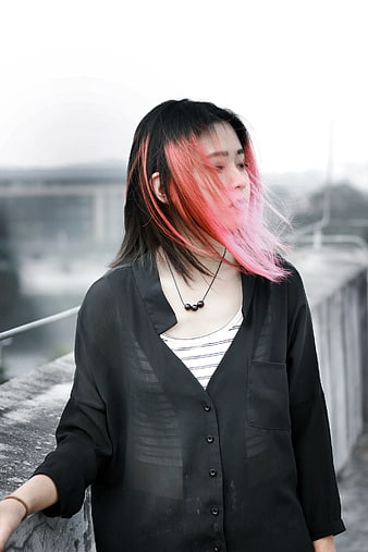 Woman with Pink Hair on Windy Rooftop