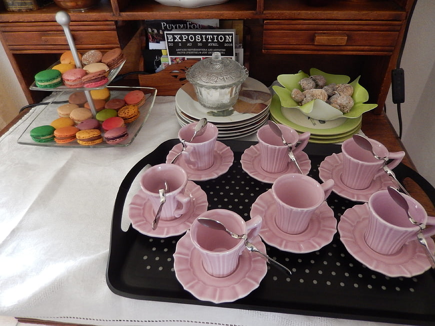 Pink Tea Cups and Macarons on a Table