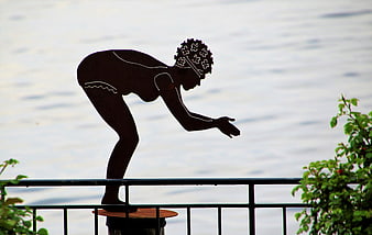 Metal Silhouette Sculpture of Woman by Lake