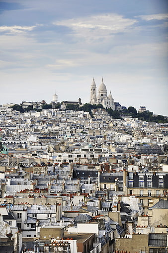 Panoramic View of Sacré-Cœur Basilica Over Paris Rooftops