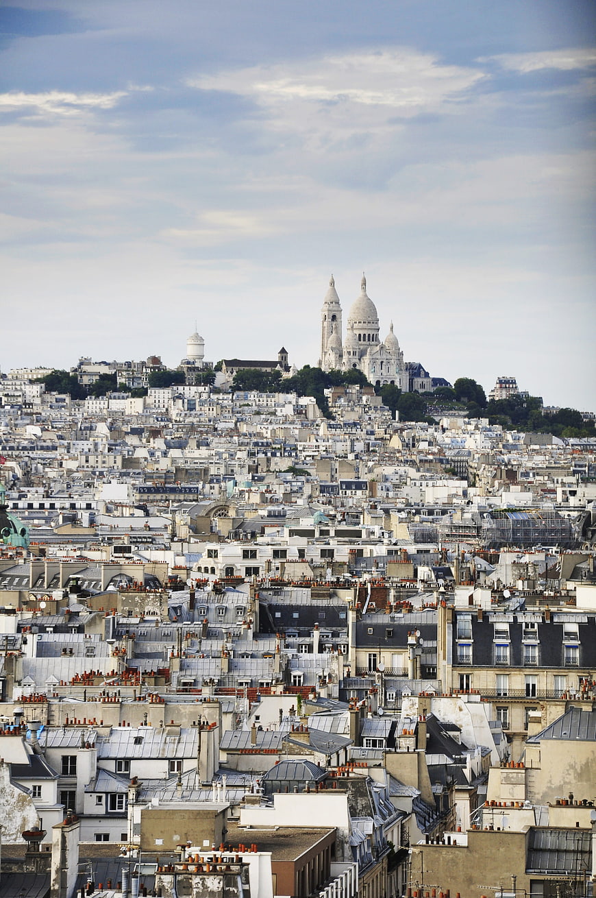Panoramic View of Sacré-Cœur Basilica Over Paris Rooftops