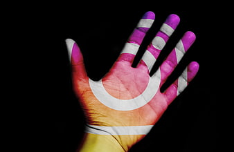 Hand with projected flag design on black background