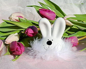 White Easter Bunny Figurine With Pink Tulips On Pink Fabric