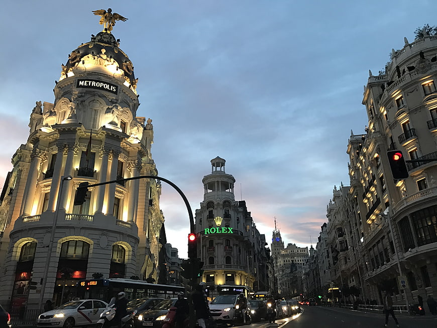 Metropolis Building and Gran Vía Street in Madrid at Dusk