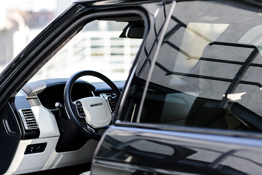 Luxury SUV Interior with White Steering Wheel