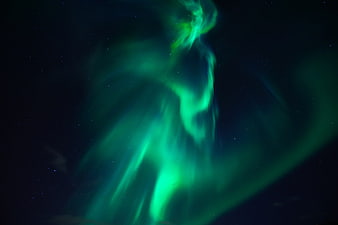 Vibrant Green Aurora Borealis in Starry Night Sky