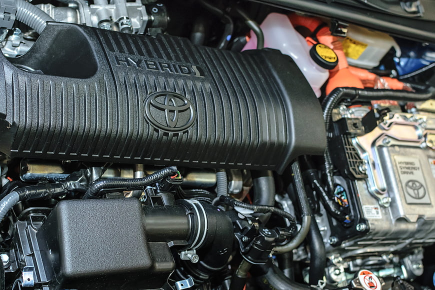 Close-up of Toyota Hybrid Engine Bay with Orange Cables