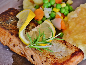 Grilled Salmon Fillet With Lemon Rosemary And Mixed Vegetables
