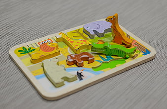 Wooden Zoo Animal Puzzle for Children on Gray Fabric