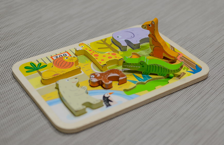 Wooden Zoo Animal Puzzle for Children on Gray Fabric