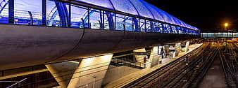 Modern Train Station Architecture at Night with Blue Lighting