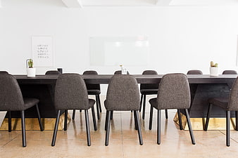 Modern Office Meeting Room With Dark Table And Gray Chairs