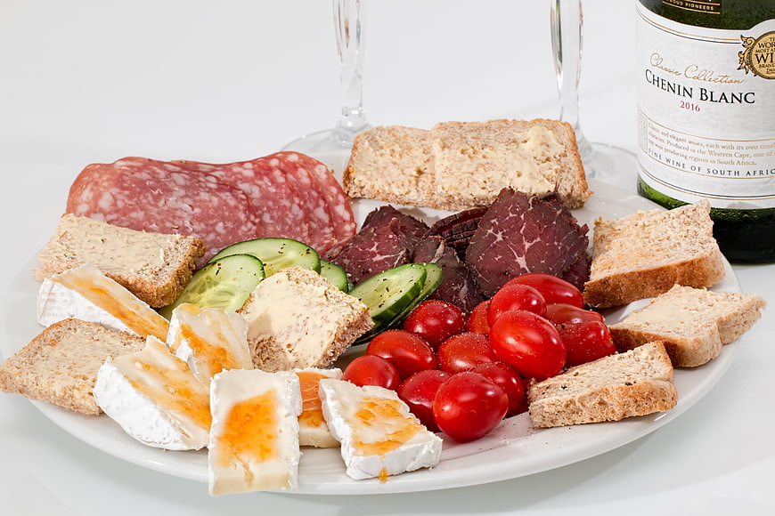Gourmet Charcuterie Board with Cheese, Meat, and Wine