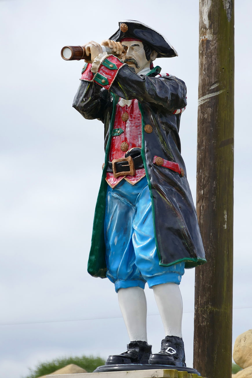 Colorful Pirate Statue Looking Through Spyglass