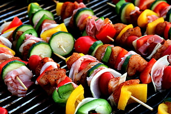 Colorful Chicken and Vegetable Kebabs Grilling on BBQ