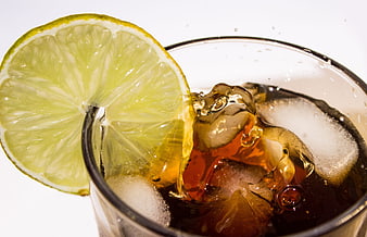 Refreshing Iced Cola Drink With Lime Slice And Ice Cubes