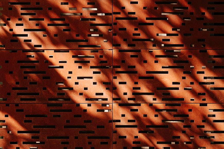 Abstract rusty metal texture with diagonal sunlight shadows