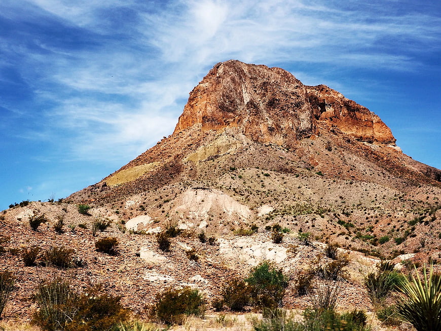 Rugged Desert Mountain Peak Under Blue Sky